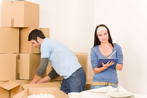 Customer consulting with removal service provider